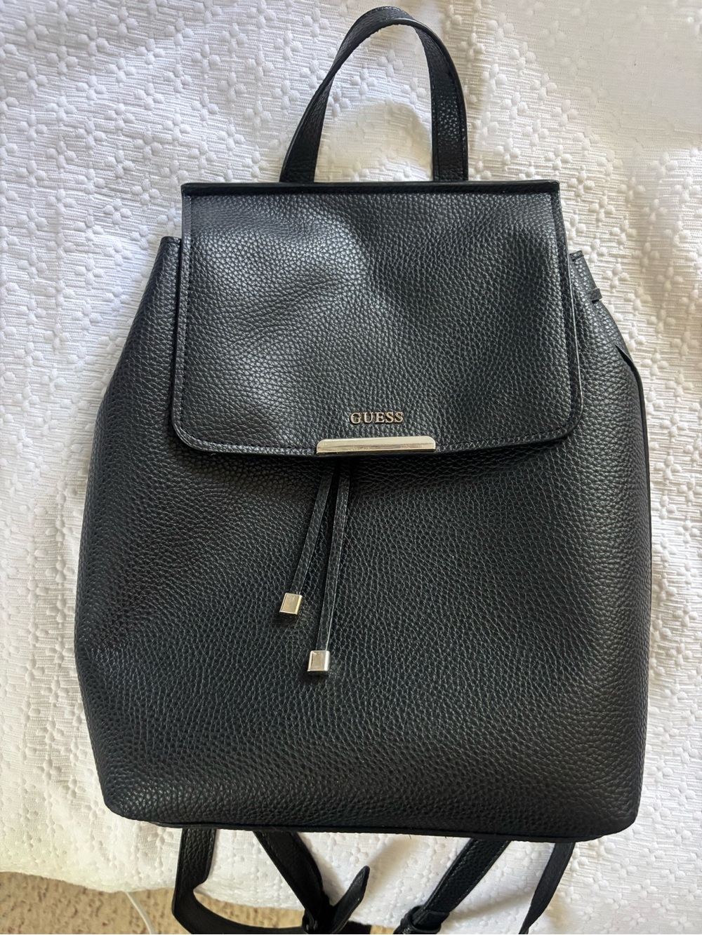 GUESS Black Pebbled Leather Drawstring Backpack with Gold Accents